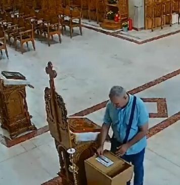 VIDEO/ Bărbat suspectat că ar fi furat bani din cutia milei, prins de poliţişti